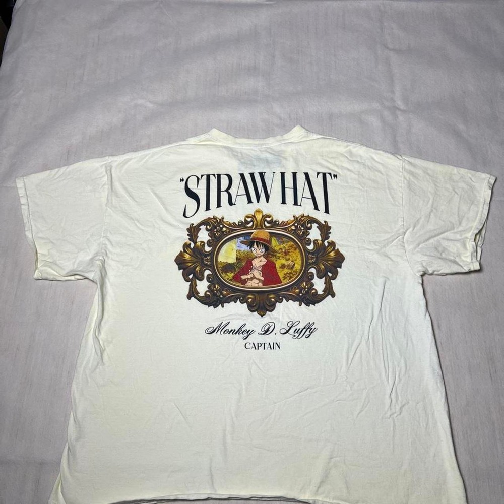 White one piece Skull Tee with black skull and laurel wreath graphic